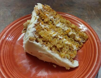 Divine Carrot Cake slice with cream cheese frosting at Fine Thyme Café