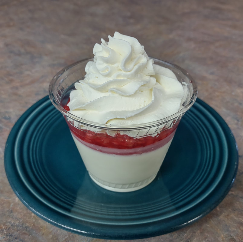 Russian Cream dessert with raspberry sauce at Fine Thyme Café